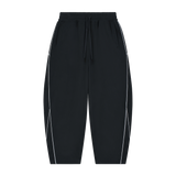 MIROLYUB Trace Piping Barrel Fleece Pants in Black, front view.