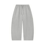 MIROLYUB Tessera waffle barrel pants in Light Gray, front view.