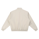 MIROLYUB Transit stand-collar bomber in Gray Camel, back view.