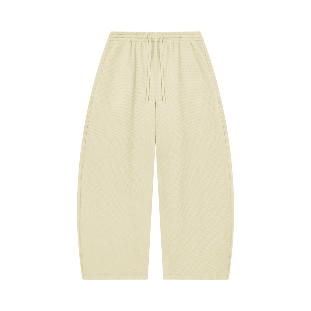 MIROLYUB Tessera waffle barrel pants in Apricot, front view.