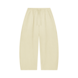 MIROLYUB Tessera waffle barrel pants in Apricot, front view.