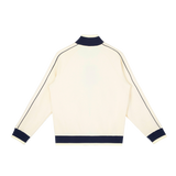 MIROLYUB Switchback raglan track jacket in Mild Apricot, back view.