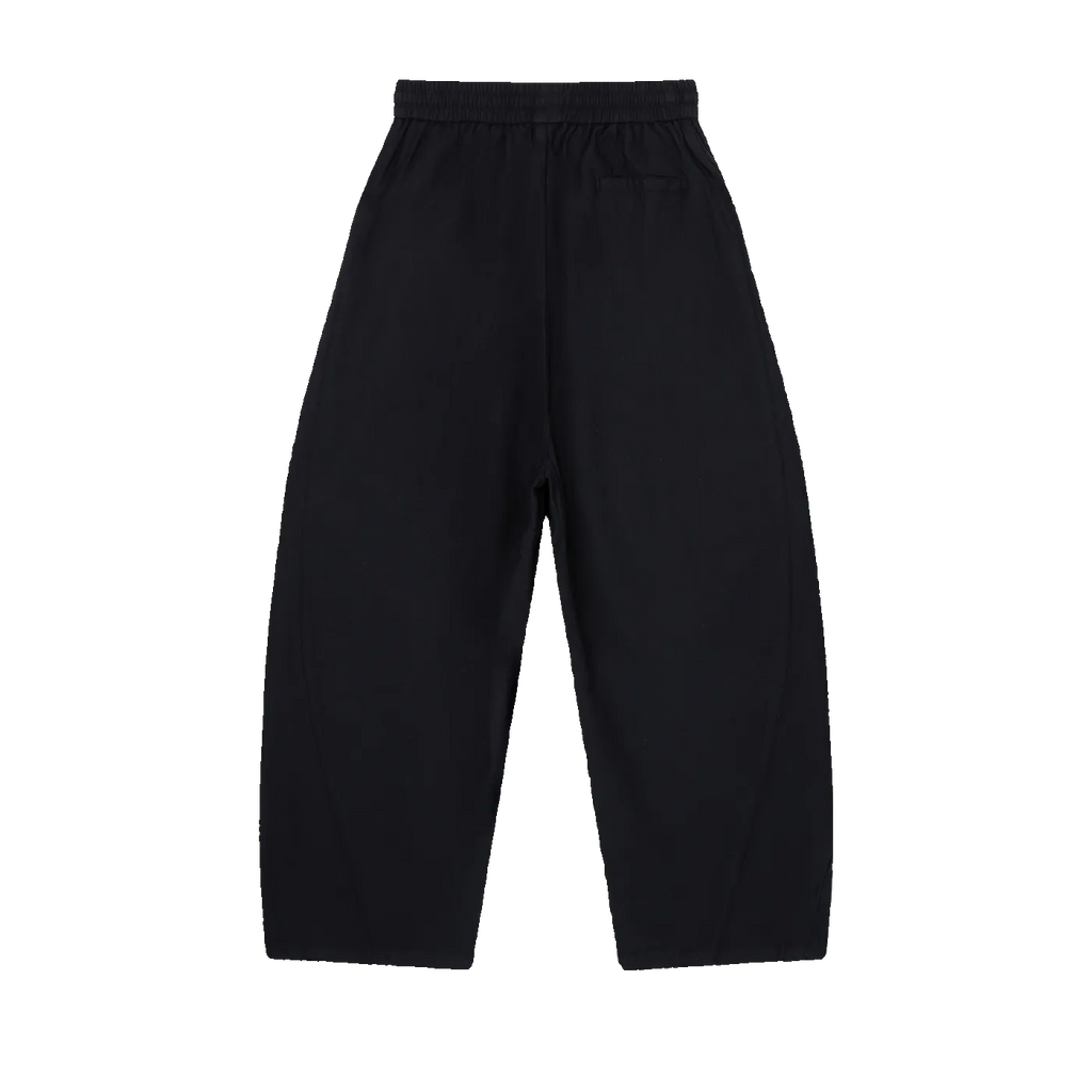 MIROLYUB Drift pants in Black, back view with wide legs and an elasticated waist