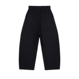 MIROLYUB Drift pants in Black, back view with wide legs and an elasticated waist