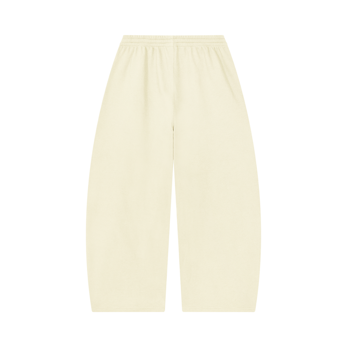MIROLYUB Tessera waffle barrel pants in Mild Apricot, back view.