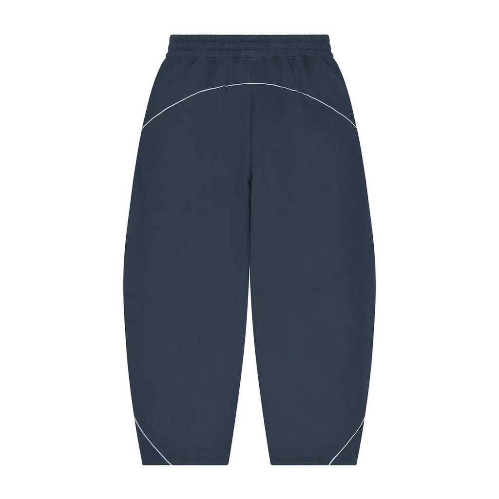 MIROLYUB Trace Piping Barrel Fleece Pants in Navy Blue, back view.