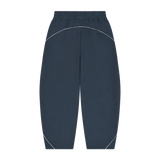 MIROLYUB Trace Piping Barrel Fleece Pants in Navy Blue, back view.