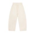 MIROLYUB Drift pants in Mild Apricot, front view with wide legs, tonal panels and a drawstring waist