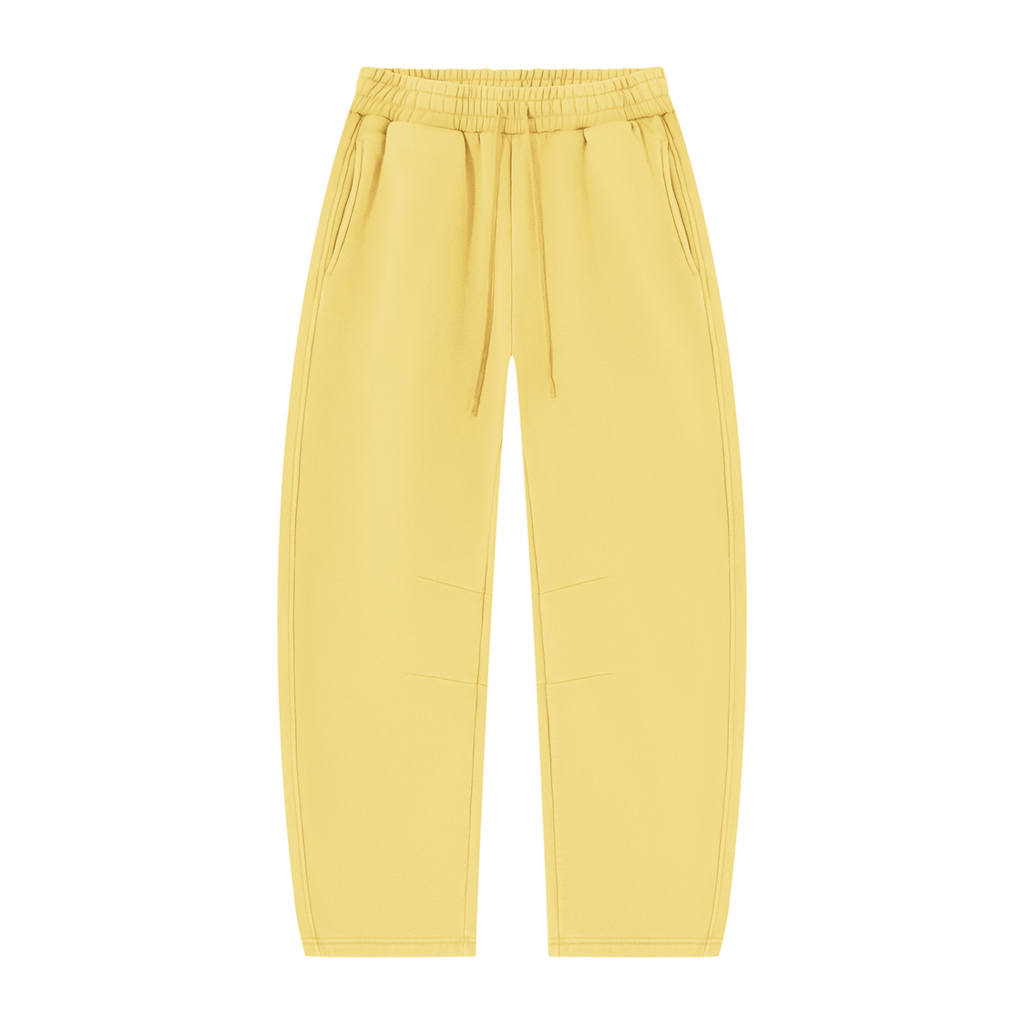 MIROLYUB Arc Vintage-Wash Barrel Fleece Pants in Light Yellow, front view.