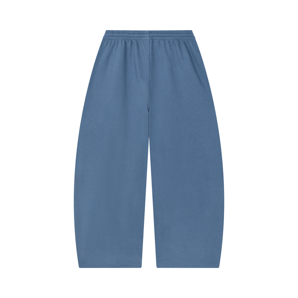 MIROLYUB Tessera waffle barrel pants in Jeans Blue, back view.