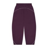 MIROLYUB Trace Piping Barrel Fleece Pants in Plum Purple, back view.