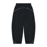MIROLYUB Trace Piping Barrel Fleece Pants in Black, back view.