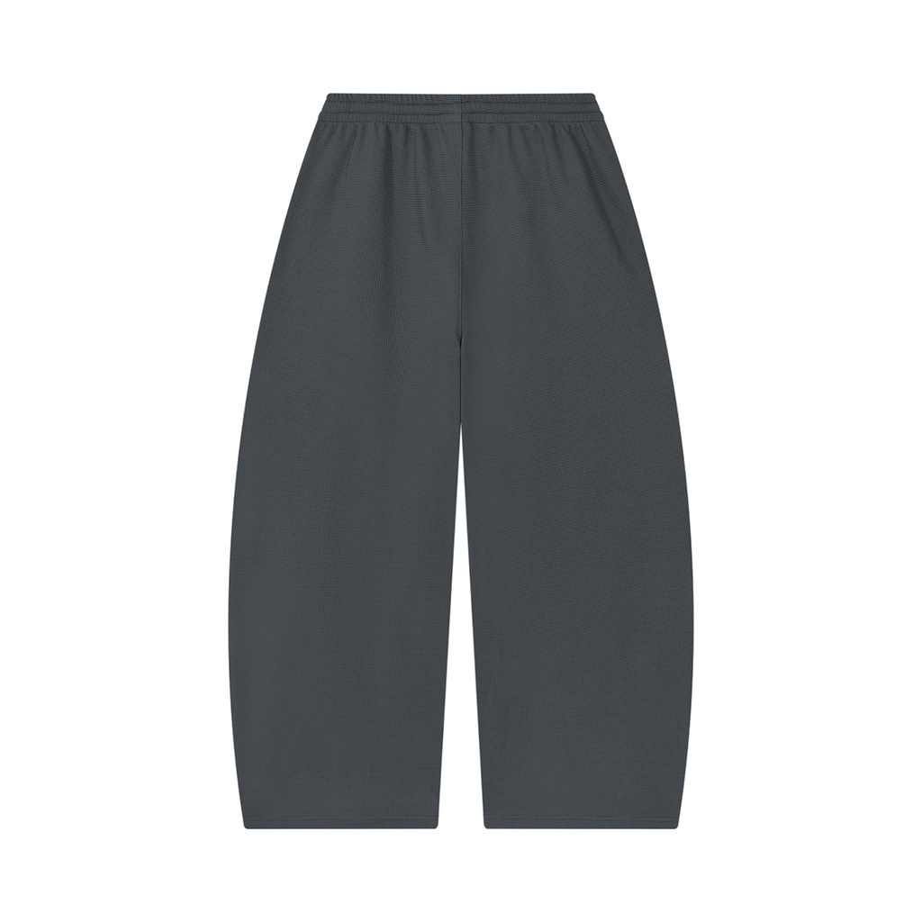 MIROLYUB Tessera waffle barrel pants in Dark Gray, back view.