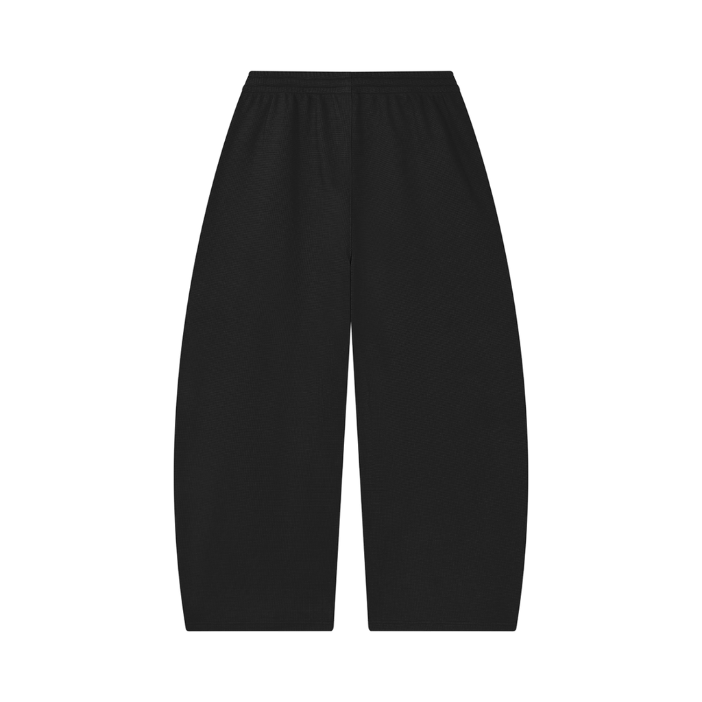 MIROLYUB Tessera waffle barrel pants in Black, back view.