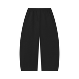 MIROLYUB Tessera waffle barrel pants in Black, back view.