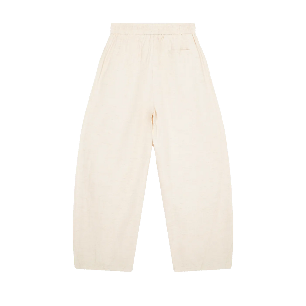 MIROLYUB Drift pants in Mild Apricot, back view with wide legs and an elasticated waist