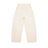 MIROLYUB Drift pants in Mild Apricot, back view with wide legs and an elasticated waist