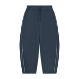 MIROLYUB Trace Piping Barrel Fleece Pants in Navy Blue, front view.