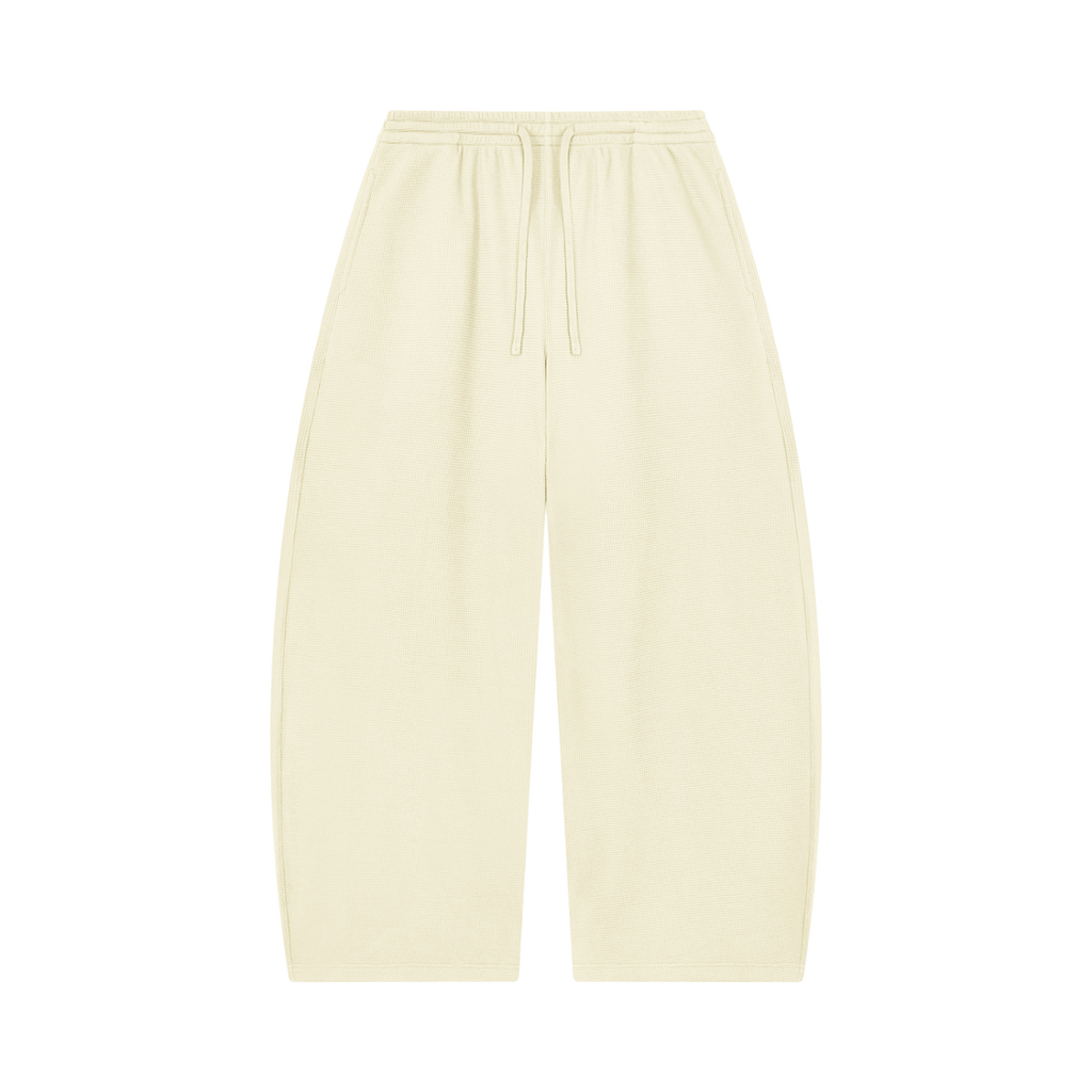 MIROLYUB Tessera waffle barrel pants in Mild Apricot, front view.