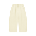 MIROLYUB Tessera waffle barrel pants in Mild Apricot, front view.