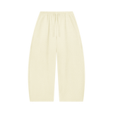 MIROLYUB Tessera waffle barrel pants in Mild Apricot, front view.
