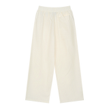 MIROLYUB Axis striped pleated trousers in White, back view.