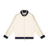 MIROLYUB Switchback raglan track jacket in Mild Apricot, front view.