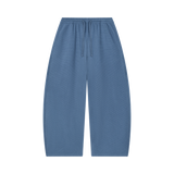 MIROLYUB Tessera waffle barrel pants in Jeans Blue, front view.