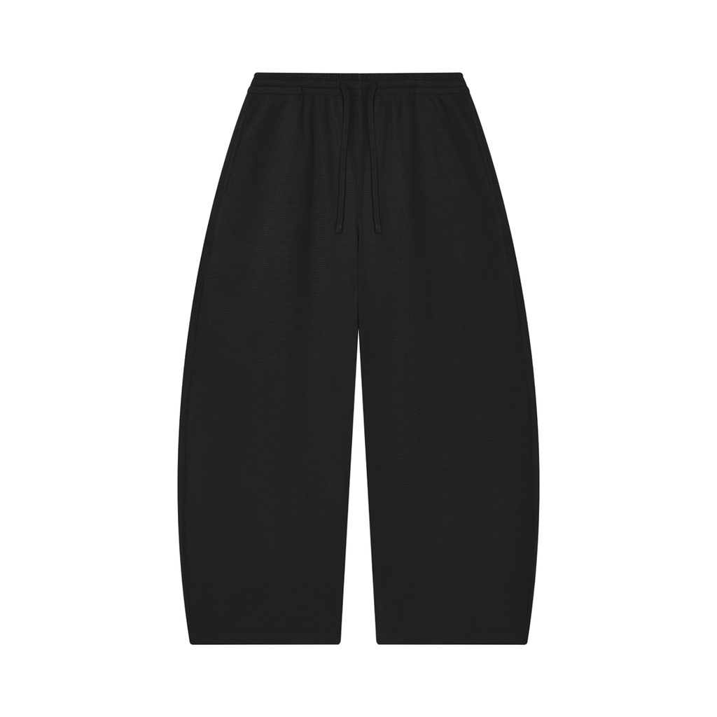 MIROLYUB Tessera waffle barrel pants in Black, front view.