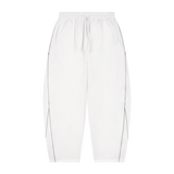 MIROLYUB Trace Piping Barrel Fleece Pants in White, front view.