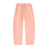 MIROLYUB Arc Vintage-Wash Barrel Fleece Pants in Light Pink, front view.