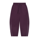 MIROLYUB Trace Piping Barrel Fleece Pants in Plum Purple, front view.