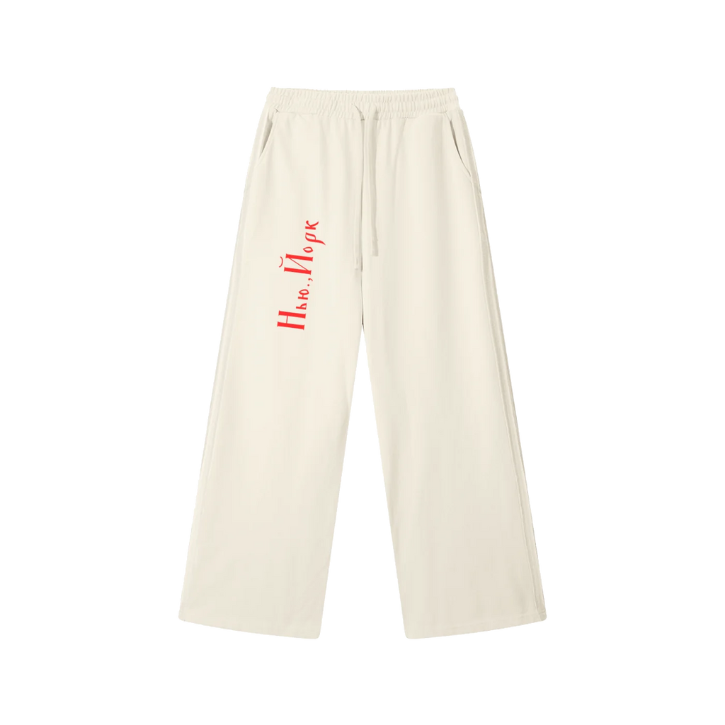 Front view of Mild Apricot drawstring sweatpants with red New York Cyrillic lettering
