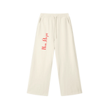 Front view of Mild Apricot drawstring sweatpants with red New York Cyrillic lettering