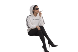 Seated model wearing a white God Forgives hoodie with black sleeve stripes, black tights, sunglasses and heeled boots