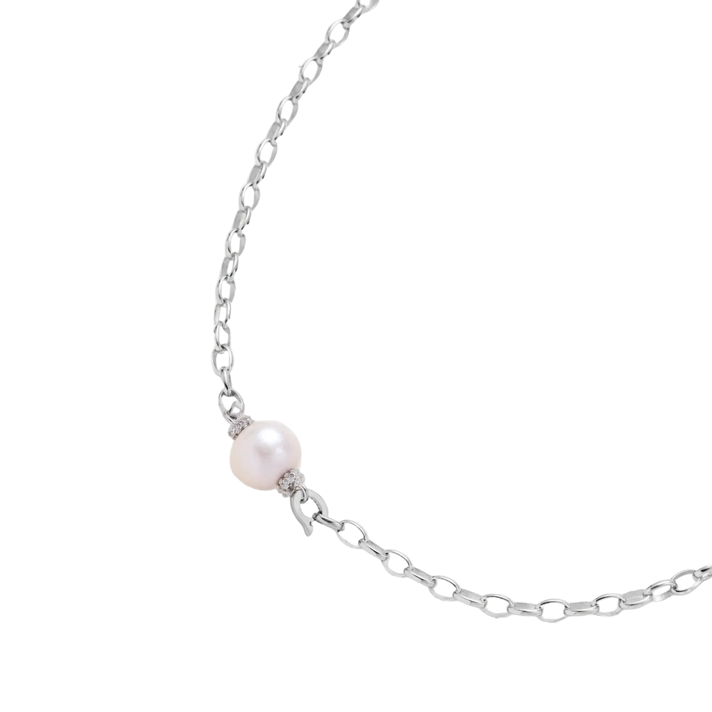 Angled detail of Mira necklace showing a freshwater pearl between pavé rondelles and silver oval links