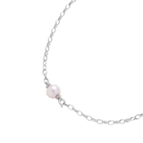 Angled detail of Mira necklace showing a freshwater pearl between pavé rondelles and silver oval links