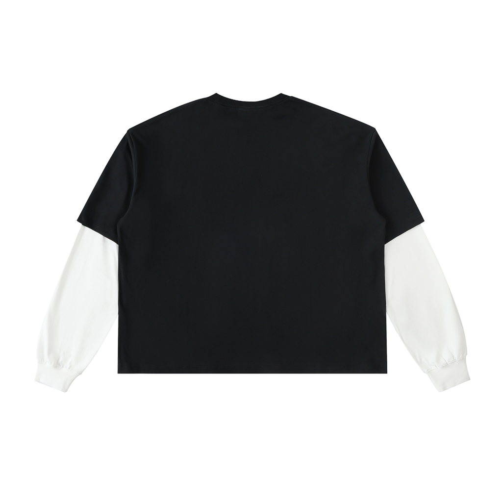 Back view of black layered-sleeve cotton tee with white contrast sleeves