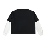 Back view of black layered-sleeve cotton tee with white contrast sleeves