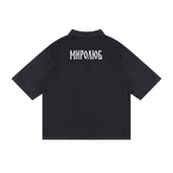Back view of washed black short-sleeve lyocell shirt with white MIROLYUB Cyrillic wordmark