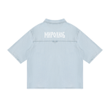 Back view of light blue short-sleeve lyocell shirt with white MIROLYUB Cyrillic wordmark