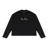 Front view of black raw-edge long sleeve with white New York Cyrillic lettering