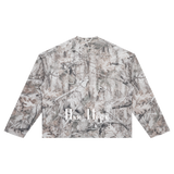 Back view of tree-camouflage waffle long sleeve with white New York Cyrillic lettering near the hem