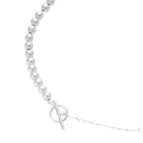 Close-up of Svetislav necklace showing sterling silver beads, a fine chain and a toggle clasp