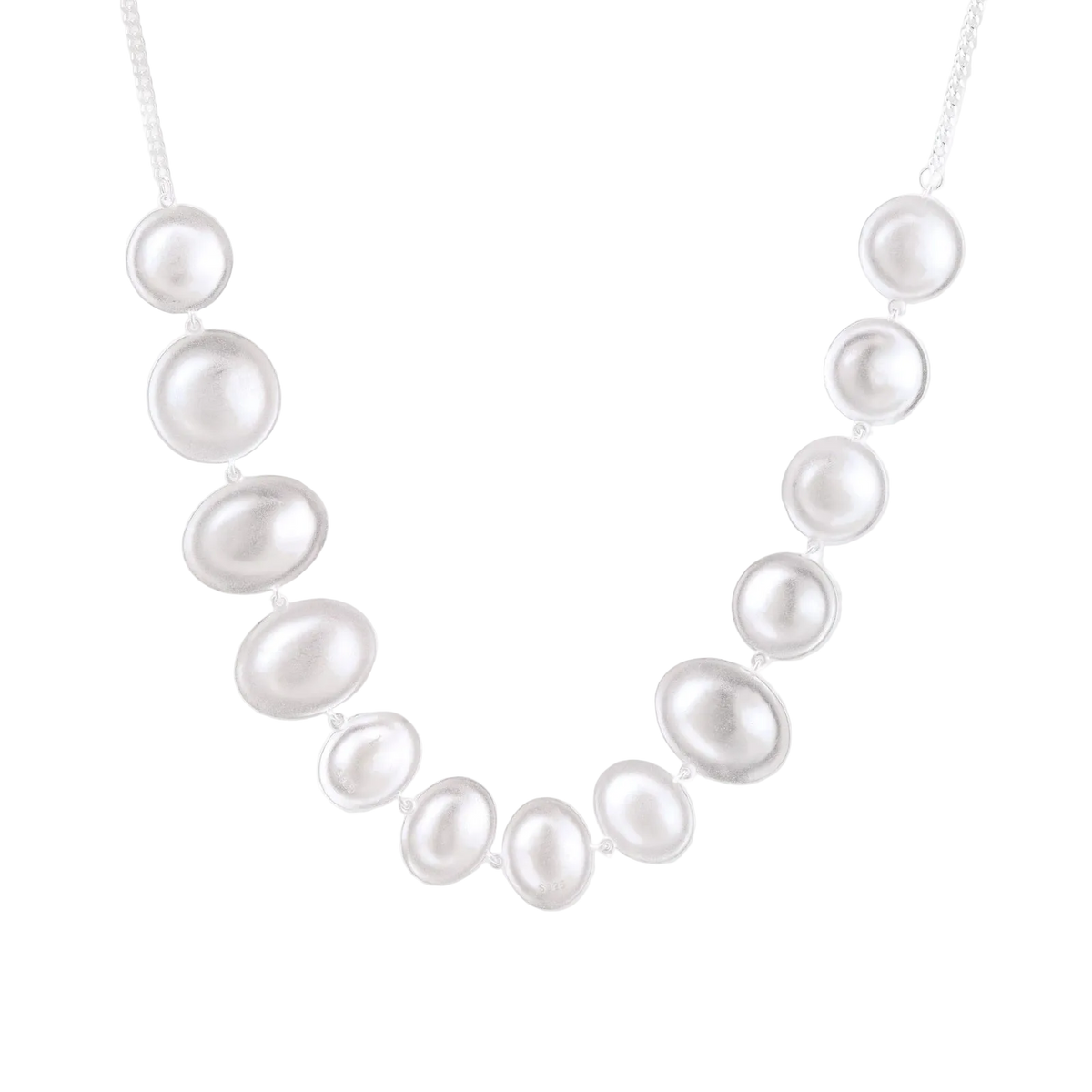 Svetozar sterling silver necklace detail showing graduated rounded discs with a brushed finish