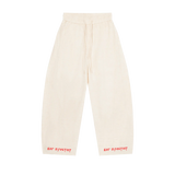 Cream MIROLYUB wide-leg drawstring pants with red hem lettering, front view.