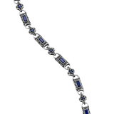 Close-up of Vladislav necklace showing blue cubic zirconia in rectangular and round link settings