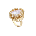 Angled view of Vladislava ring: iridescent baroque pearl in a gold-plated open cage with clear crystal flowers and an adjustable band